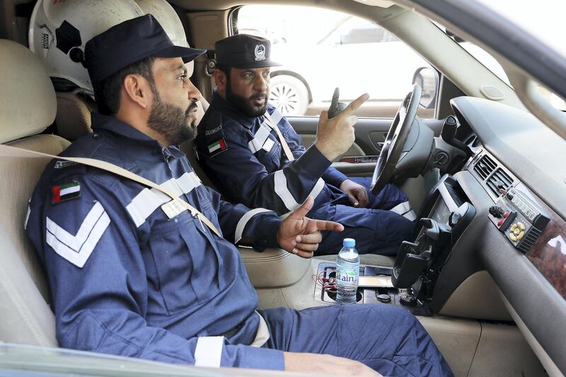 DUBAI , UNITED ARAB EMIRATES , Oct 1  ��� 2017 :- Left to Right - Mohammed Thabit M. Al Saadi and  Mohammed Ahmed Al Saadi , Dubai Police officers in their rescue vehicle at the Dubai Police Search and Rescue Department on Sheikh Mohammed Bin Zayed road near International City in Dubai.  ( Pawan Singh / The National ) Story by Nawal