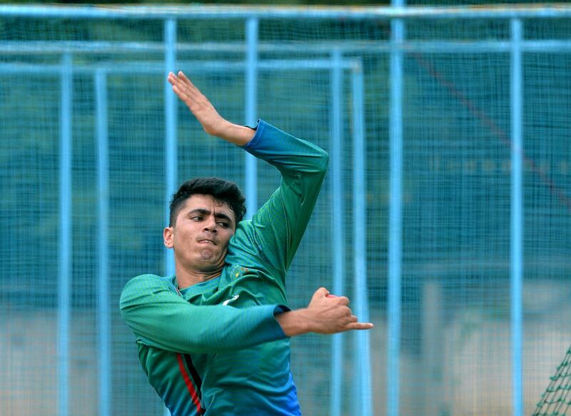 Afghanistan spinner Mujeeb-Ur-Rahman bowls in the nets during a practice session at the M. Chinnaswamy Stadium in Bangalore on June 12, 2018.
India and Afghanistan will play their one off test match in Bangalore from June 14. / AFP PHOTO / MANJUNATH KIRAN / ----IMAGE RESTRICTED TO EDITORIAL USE - STRICTLY NO COMMERCIAL USE----- / GETTYOUT