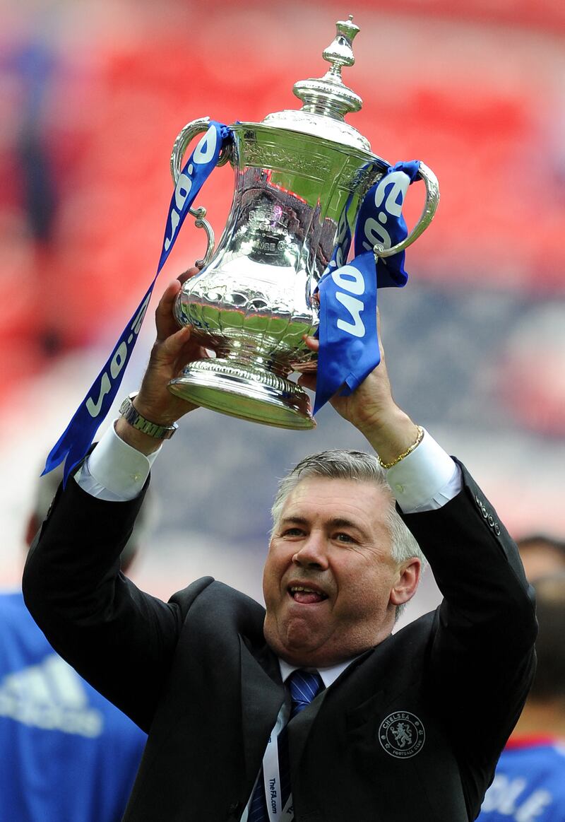Chelsea manager Carlo Ancelotti lifts the FA Cup after his team beat Portsmouth 1-0 in the final at Wembley on May 15, 2010. AFP