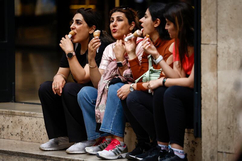 People eat ice cream in Istanbul as the country prepares for an election run-off later this month. Getty