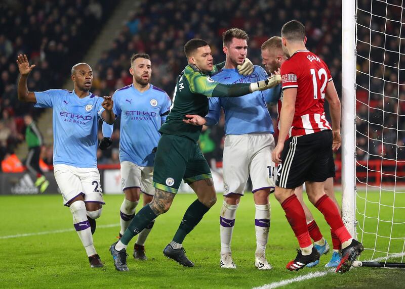 Aymeric Laporte with Oliver McBurnie of Sheffield United on his return from injury. Getty