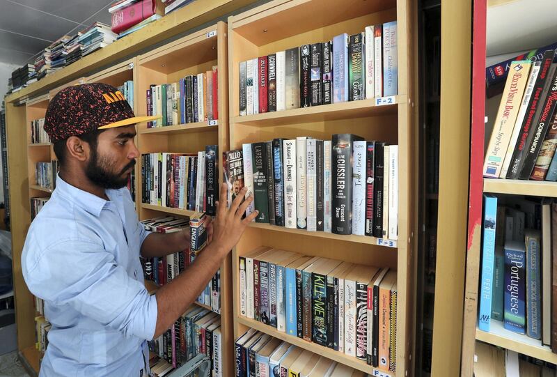 Abu Dhabi, United Arab Emirates - July 10th, 2018: Worker Fayiz Rahman. Thrift distribution and Books, Abu Dhabi's only secondhand bookshop. Tuesday, July 10th, 2018 in Abu Dhabi. Chris Whiteoak / The National