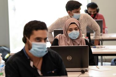 Operators at Dubai's Covid-19 command and control centre at Mohammed bin Rashid University, Dubai, on June 1, 2020. AFP 