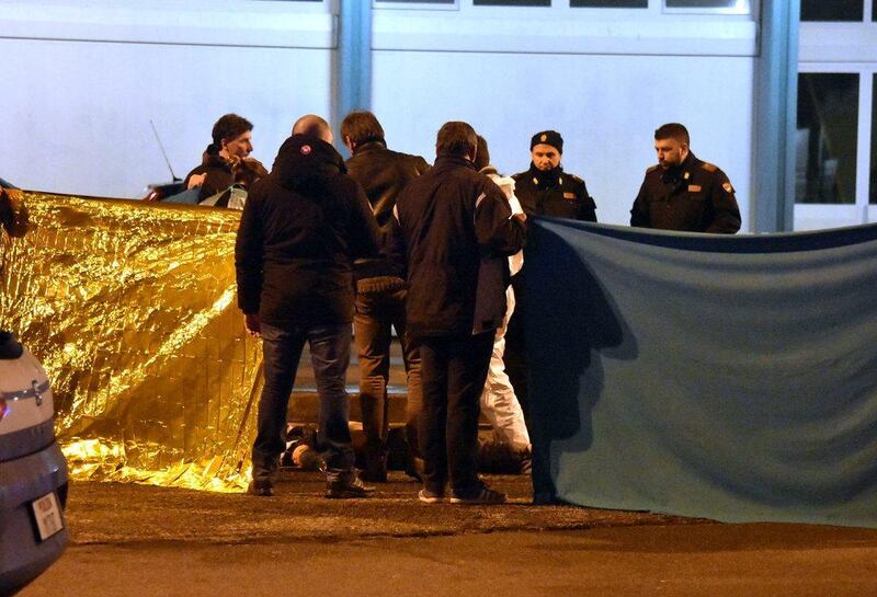 Italian police cordon off an area around a body after a shoot-out between police and a man in Milan’s Sesto San Giovanni neighbourhood. Italy’s interior minister Marco Minniti says the man killed is “without a shadow of doubt” the suspected Berlin Christmas market attacker Anis Amri. Daniele Bennati / Associated Press