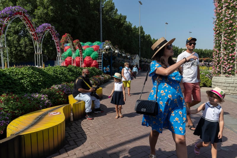 Visitors wander through Dubai Miracle Garden on opening day for season 10 in 2021. 