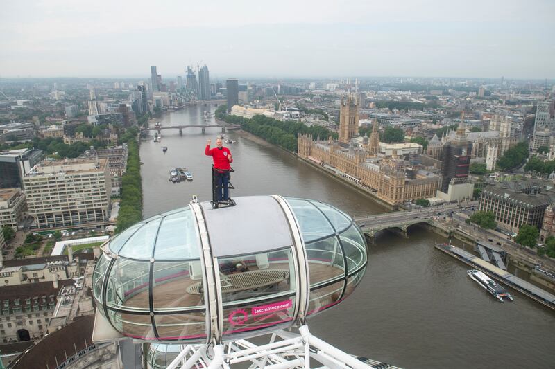 England 1966 World Cup winner Geoff Hurst stands on top of a pod on the London Eye wearing a replica of the famous red shirt worn at the 1966 final.