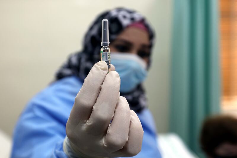 A medical worker prepares to give a vaccination against Covid-19 at a clinic in Jordan’s capital, Amman. Photo: EPA