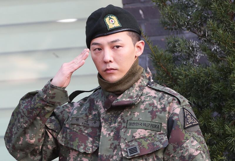 G-Dragon, a member of South Korean boy band BIGBANG, salutes after being discharged from military service at a military base in Yongin, South Korea, 26 October 2019. EPA