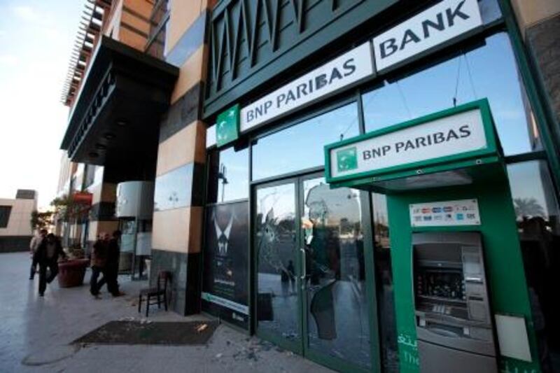 A BNP Paribas bank branch remains damaged on the Arcadia shopping center, that was looted, damaged and set on fire by people in Cairo, Egypt, Sunday Jan. 30, 2011. (AP Photo/Lefteris Pitarakis)
