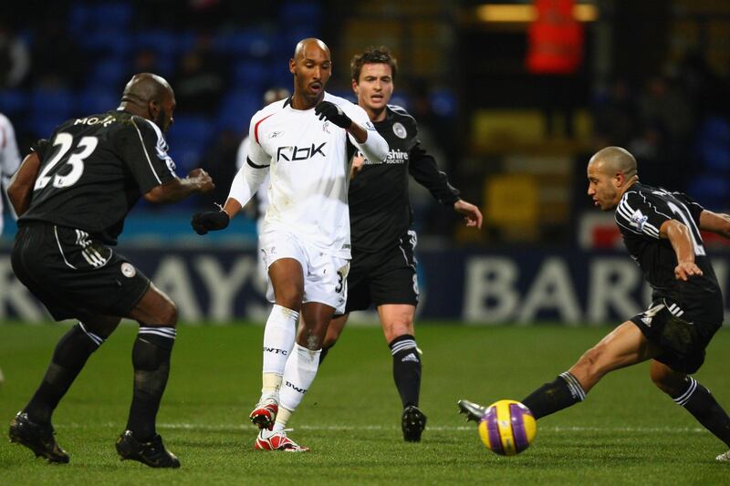 BOLTON, UNITED KINGDOM - JANUARY 02:  Nicolas Anelka (2nd left) of Bolton threads a pass by Tyrone Mears (right) and Darren Moore (left) during the Barclays Premier League match between Bolton Wanderers and Derby County at the Reebok Stadium on January 2, 2008 in Bolton, England.  (Photo by Michael Steele/Getty Images)