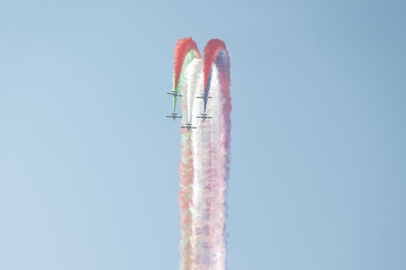 Aircraft perform manoeuvres at the airshow. 