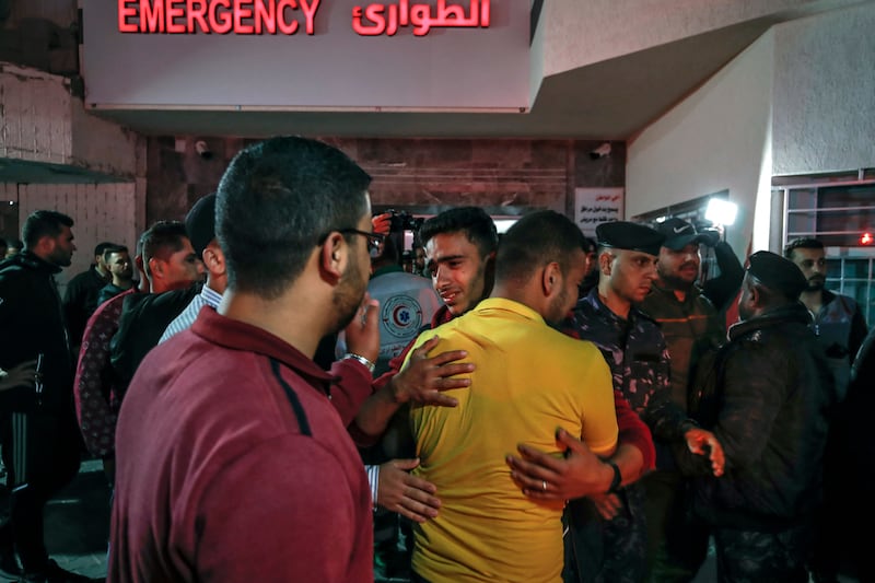 Men mourn outside Al Shifa hospital in the Gaza Strip. AFP