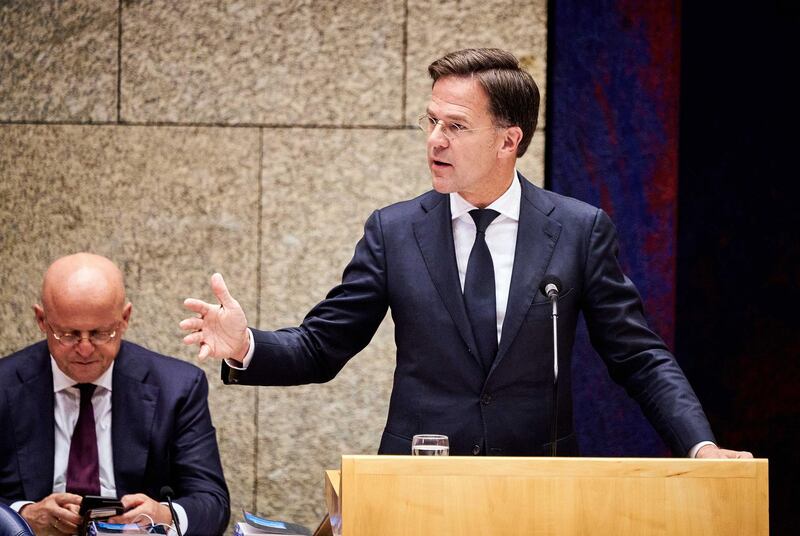 epa08521447 Dutch Minister of Justice and Security Ferdinand Grapperhaus (L) and Dutch Prime Minister Mark Rutte (R) in the House of Representatives during a debate on institutional racism in the Netherlands, in The Hague, the Netherlands, 01 July 2020.  EPA/PHIL NIJHUIS