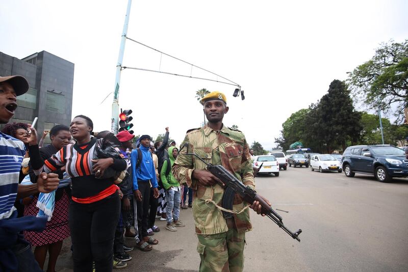 Soldiers on the streets as people, head for a solidarity rally, on the removal of Zimbabwean president Robert Mugabe, at the Zimbabwe Grounds in Highfield, Harare, Aaron Ufumeli / EPA