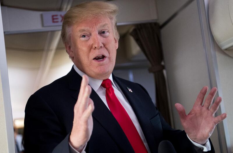 US President Donald Trump speaks to the press aboard Air Force One in flight as he travels from Joint Base Andrews in Maryland, to Bedminster, New Jersey, June 29, 2018. Trump denied he is planning to withdraw the United States from the World Trade Organization. "I'm not talking about pulling out," he told reporters on Air Force One when asked about reports he was planning an exit from the global trading body.

 / AFP / SAUL LOEB
