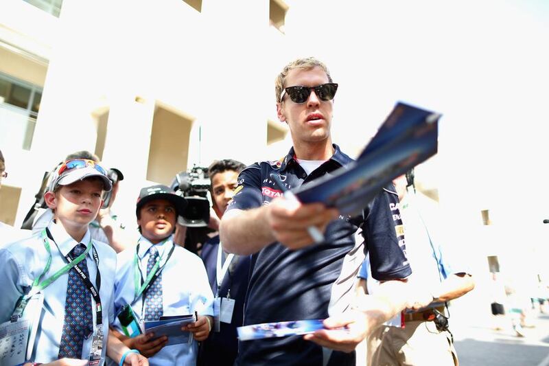 A reader says some Formula One drivers disappointed many fans who spent hours standing in the queue on Thursday to get their autographs. Above, Sebastian Vettel signs autographs for young fans. Clive Mason / Getty Images