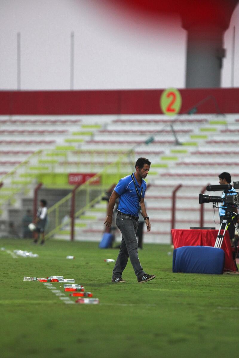 Dubai, UAE, October 14, 2012:

Dubai and Ajman faced off tonight in the Etisalat Cup. Ajaman , in the end, was victorious, 2-1, after a very sloppy first half. 

Dubai's Head COach, Enrique "Quique" S‡nchez Flores, paces up and down the pitch. 

Lee Hoagland/The National