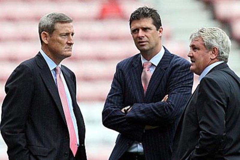 Niall Quinn, centre, will now focus on Sunderland' international development, including a business trip to Abu Dhabi, while Ellis Short, the owner, left, takes over as chairman.