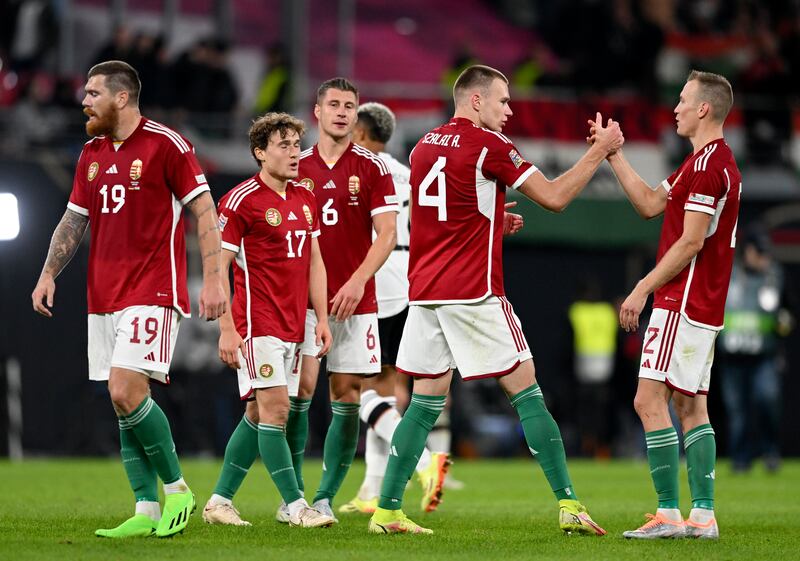 Hungary players celebrate at the final whistle. EPA