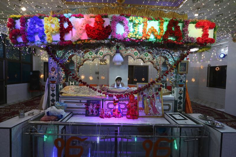 A boy prays at a Hindu temple in Sukkur, Pakistan, during Diwali. AP