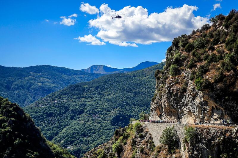 A helicopter hovers over the action during Stage 2 of the Tour de France on Sunday, August 30. EPA