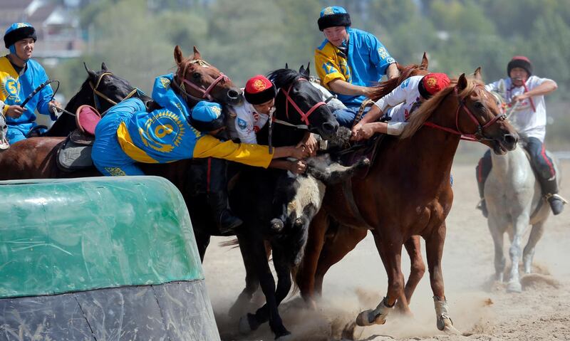 Kazakh and Russian horsemen take part in kok-boru. EPA