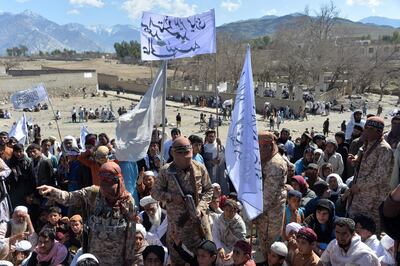 Afghan Taliban militants and villagers attend a gathering as they celebrate the peace deal and their victory in the Afghan conflict on US in Afghanistan, in Alingar district of Laghman Province on March 2, 2020. The Taliban said on March 2 they were resuming offensive operations against Afghan security forces, ending the partial truce that preceded the signing of a deal between the insurgents and Washington.  / AFP / NOORULLAH SHIRZADA
