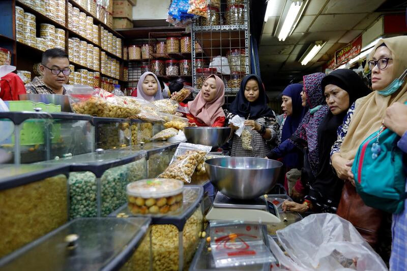 Women shop for snacks as they prepare for celebrating Eid Al Fitr, at a traditional market in Jakarta, Indonesia. Reuters