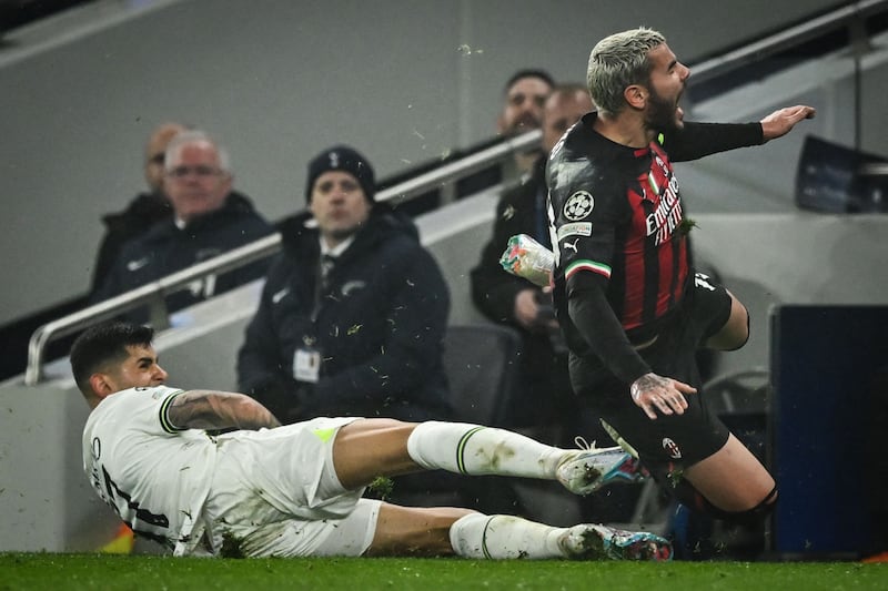 Tottenham's Cristian Romero fouls Theo Hernandez of AC Milan. AFP