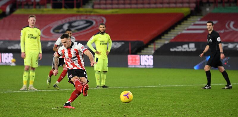 Sheffield United's English striker Billy Sharp shoots from the penalty spot to score his team's opening goal during the English Premier League football match between Sheffield United and Newcastle United at Bramall Lane in Sheffield, northern England on January 12, 2021. RESTRICTED TO EDITORIAL USE. No use with unauthorized audio, video, data, fixture lists, club/league logos or 'live' services. Online in-match use limited to 120 images. An additional 40 images may be used in extra time. No video emulation. Social media in-match use limited to 120 images. An additional 40 images may be used in extra time. No use in betting publications, games or single club/league/player publications.
 / AFP / POOL / Oli SCARFF / RESTRICTED TO EDITORIAL USE. No use with unauthorized audio, video, data, fixture lists, club/league logos or 'live' services. Online in-match use limited to 120 images. An additional 40 images may be used in extra time. No video emulation. Social media in-match use limited to 120 images. An additional 40 images may be used in extra time. No use in betting publications, games or single club/league/player publications.
