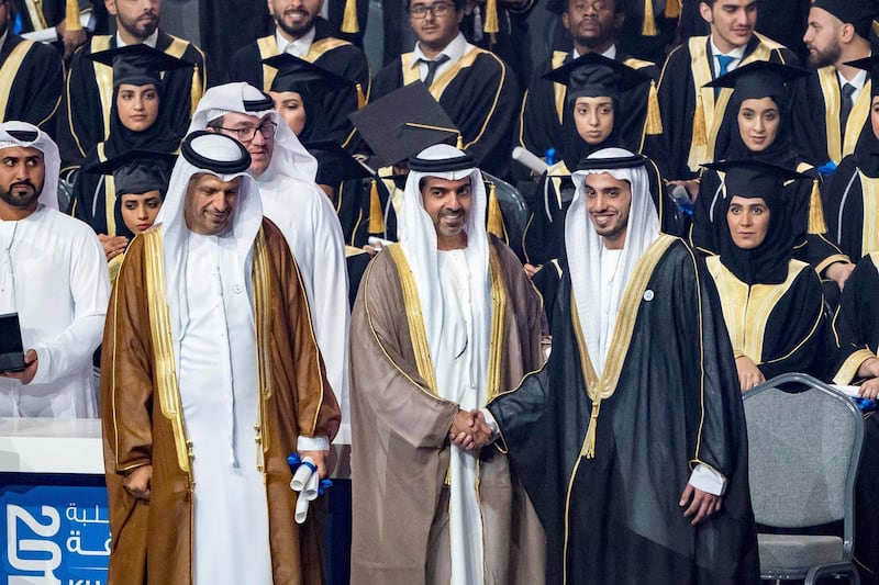 ABU DHABI, UNITED ARAB EMIRATES - October 07, 2018: HH Sheikh Hamed bin Zayed Al Nahyan, Chairman of the Crown Prince Court of Abu Dhabi and Abu Dhabi Executive Council Member (2nd L), presents a certificate to HH Sheikh Mohamed bin Khalifa bin Khaled Al Nahyan (R), during the 2018 Khalifa University Graduation ceremony at the Abu Dhabi National Exhibition Centre (ADNEC). Seen with Dr. Arif Sultan Al Hammadi, Executive Vice President of Khalifa University (L).

( Rashed Al Mansoori / Crown Prince Court - Abu Dhabi )
---