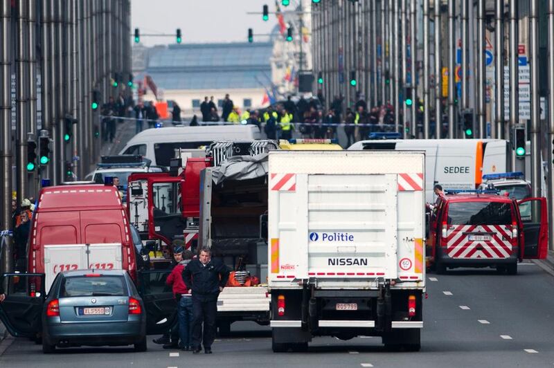 Belgian police and emergency staff arrive in the Wetstraat - Rue de la Loi, which has been evacuated after an explosion at the Maalbeek metro station in Brussels. Laurie Dieffembacq / AFP / Belga