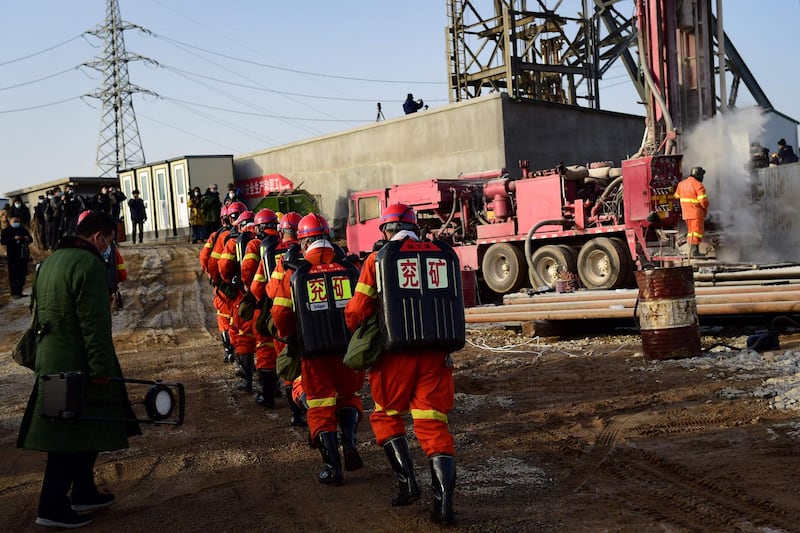 Rescuers working at the site of gold mine explosion where 22 miners were trapped underground in Qixia, in eastern China's Shandong province. AFP