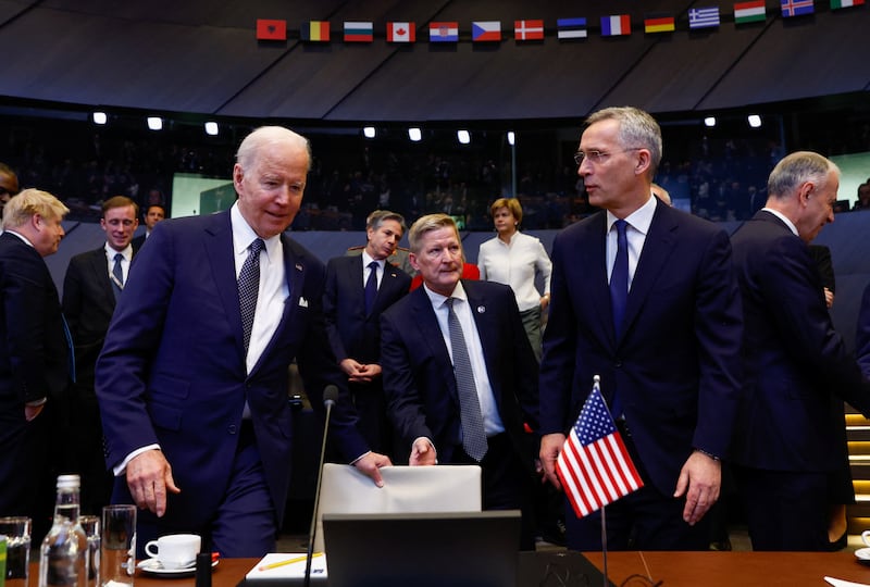 Joe Biden speaks with Jens Stoltenberg during the summit. Reuters