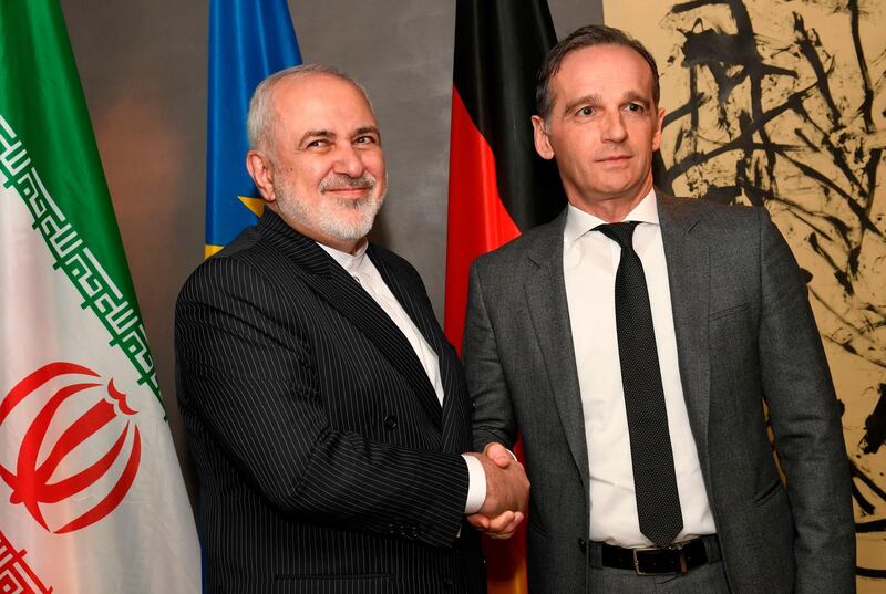 German Foreign Minister Heiko Maas (right) shakes hands with Iran's Foreign Minister Mohammad Javad Zarif during the 56th Munich Security Conference (MSC) in Munich, southern Germany.  AFP