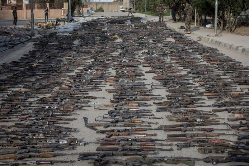 Seized ISIS weapons that were found in the last stronghold of the extremist group are displayed at an SDF base outside Al Mayadin, Syria. Getty