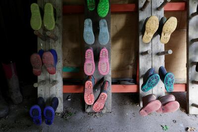 Boots are seen outside a classroom as staff make preparations at Watlington Primary School to reopen to children on June 1, following the outbreak of the coronavirus disease (COVID-19), Watlington, Britain, May 21, 2020. REUTERS/Eddie Keogh