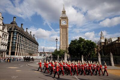 Members of the Household Cavalry march through Westminster during the procession of the coffin of Queen Elizabeth from Buckingham Palace to Westminster Hall. AP