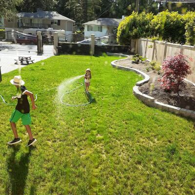 A submission taken in Canada captures a sweet moment when the photographer's younger sister, who was supposed to be watering the plants, turned the hose on a family member. Courtesy of @zayed_big__