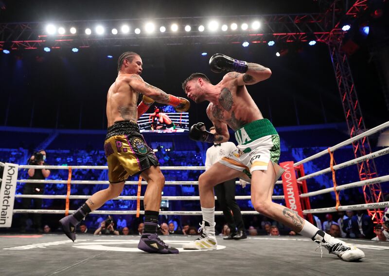 Regis Prograis, left, throws a punch at Tyrone McKenna during their WBC title eliminator super lightweight bout.