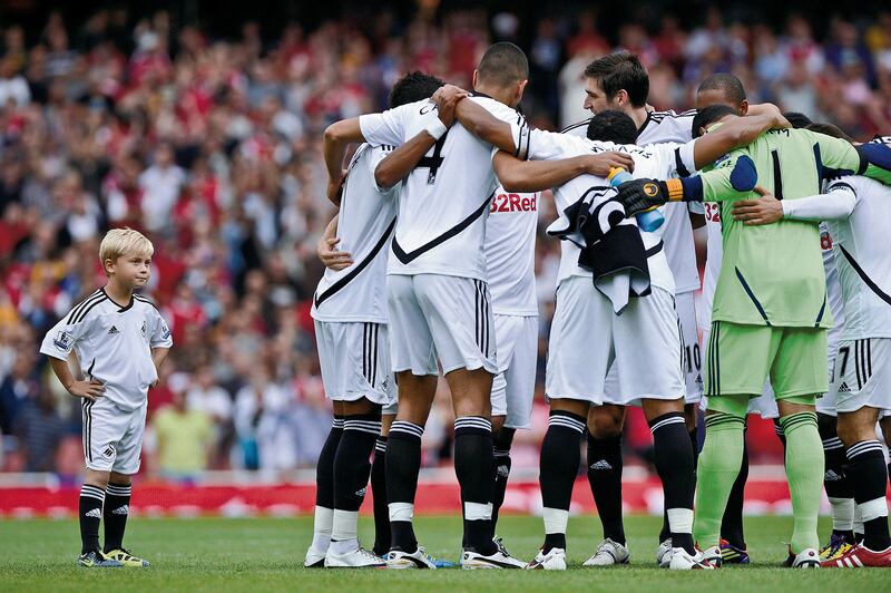 The Swansea mascot shows his displeasure at not being included in the team huddle before an away match at Arsenal. 10/09/2011. Tom Jenkins / FPA / LDY Agency
