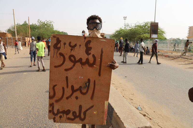 A protester holds a placard reading 'Barari Lions'. Reuters