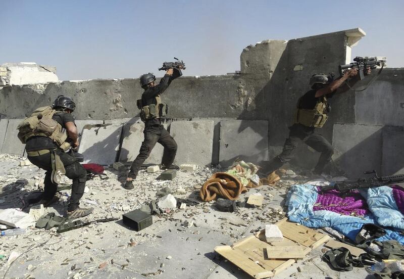 Iraqi Special Operations Forces clash with ISIL fighters in Ramadi in 2014. Stringer / Reuters