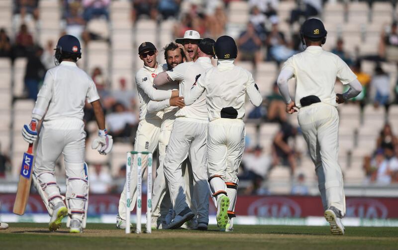 SOUTHAMPTON, ENGLAND - SEPTEMBER 02:  England spinner Moeen Ali is congratulated by team mates after dismissing Rahane after review during the 4th Specsavers Test Match between England and India at The Ageas Bowl on September 2, 2018 in Southampton, England.  (Photo by Stu Forster/Getty Images)