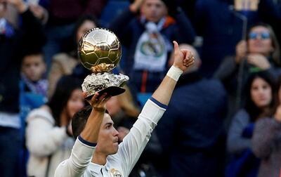 FILE PHOTO: Former Real Madrid player Cristiano Ronaldo holds his Ballon d'Or trophy at Santiago Bernabeu stadium, Madrid, Spain - 7/1/17. REUTERS/Juan Medina      TPX IMAGES OF THE DAY/File Photo