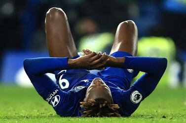 Chelsea's Tammy Abraham on the ground after the end of the Premier League soccer match against Chelsea. He had to be helped off. AP