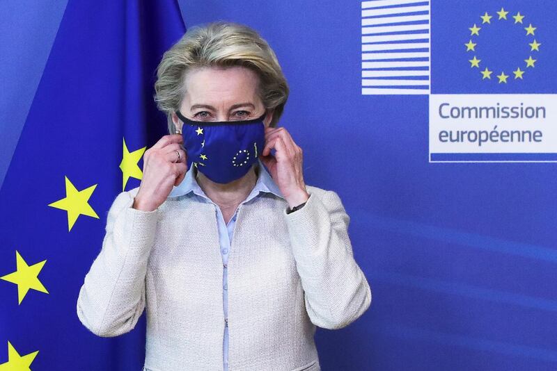 epa09179030 European Commission President Ursula von der Leyen removes her mask while meeting with Jordan's King Abdullah II ibn Al Hussein (not pictured) in Brussels, Belgium, 05 May 2021.  EPA/YVES HERMAN / POOL