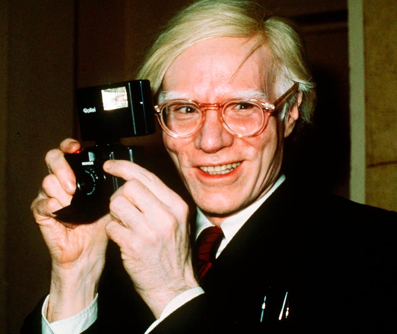 Pop artist Andy Warhol all smiles in New York, New York in 1976. AP