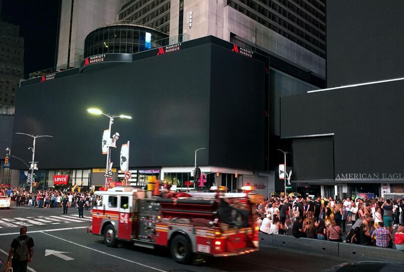 Times Square's billboards are dark after a power outage hit Manhattan in New York City.  AFP