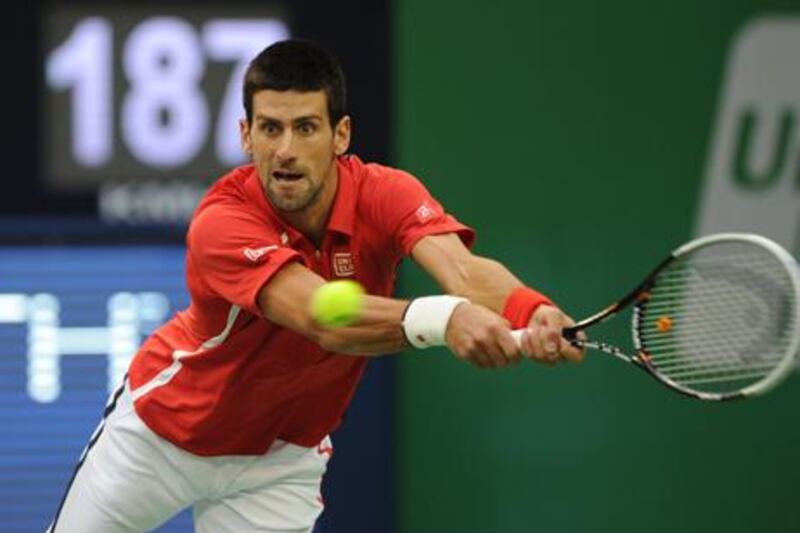 Novak Djokovic returns a shot to Andy Murray in the Shanghai Masters final